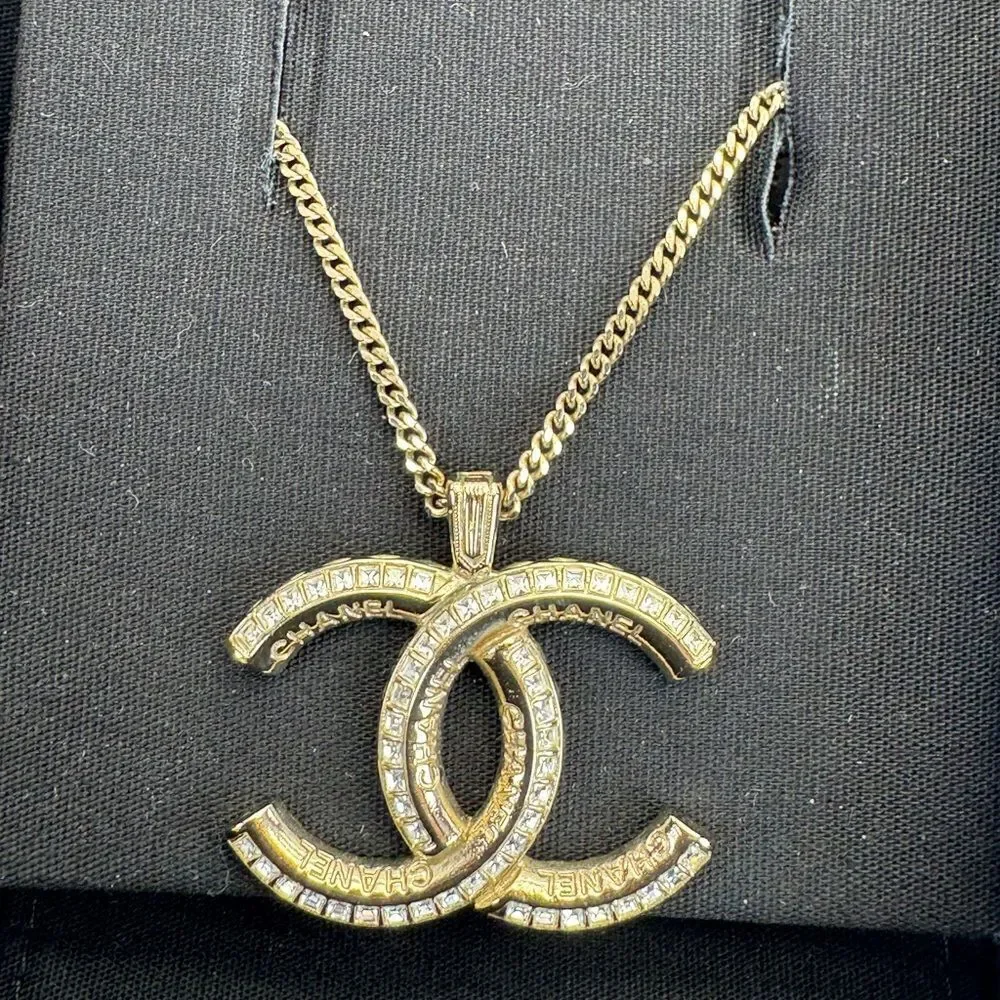 CHANEL Multi Logo Engraved Gold Crystal CC Pendant Necklace